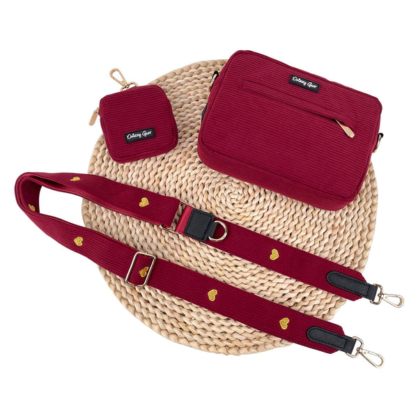 Red bags with a strap on a woven surface