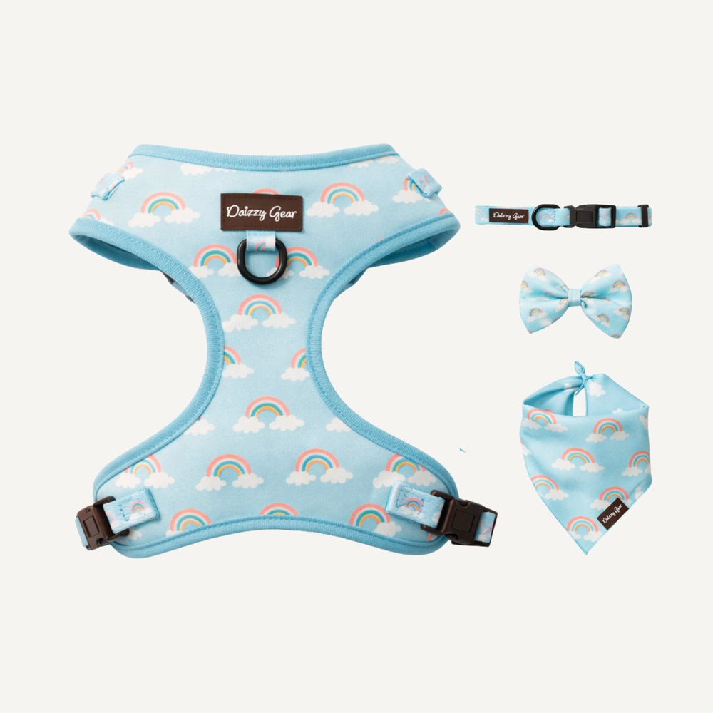 Dog harness, collar, and bandana set with rainbow and cloud pattern on a white background